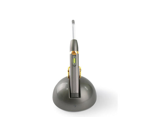 Cybird gold dual band LED curing light with charger base.